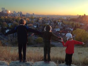 Three kids on hill